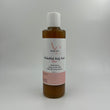 Small bottle with a label on a light gray background