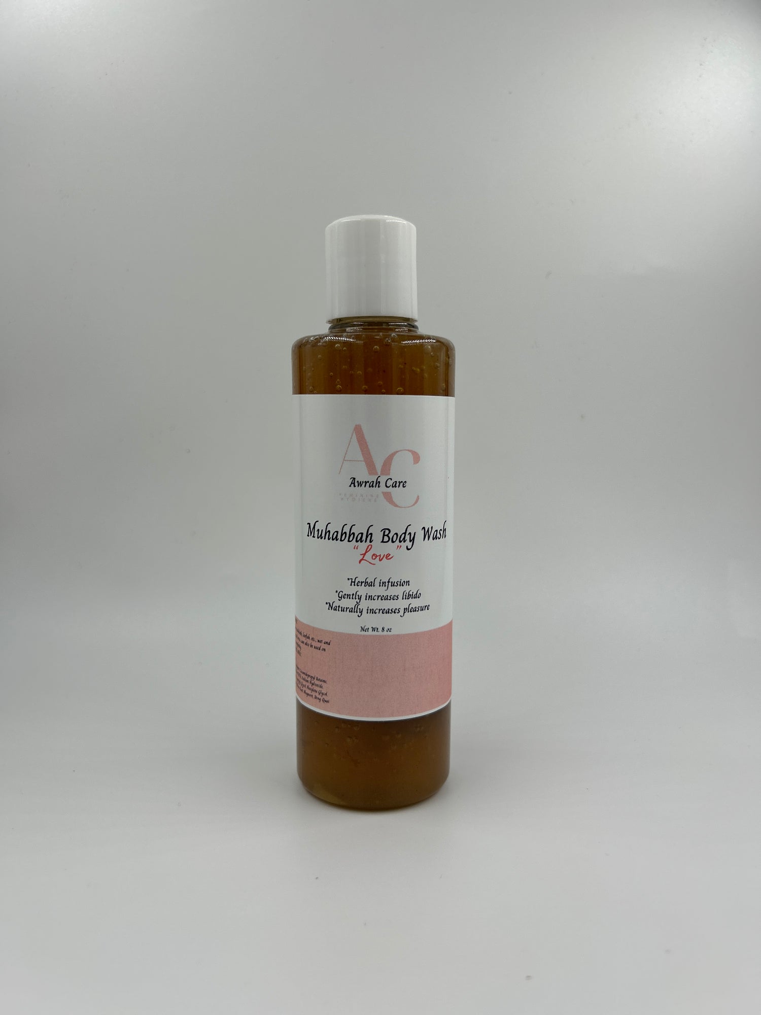 Small bottle with a label on a light gray background