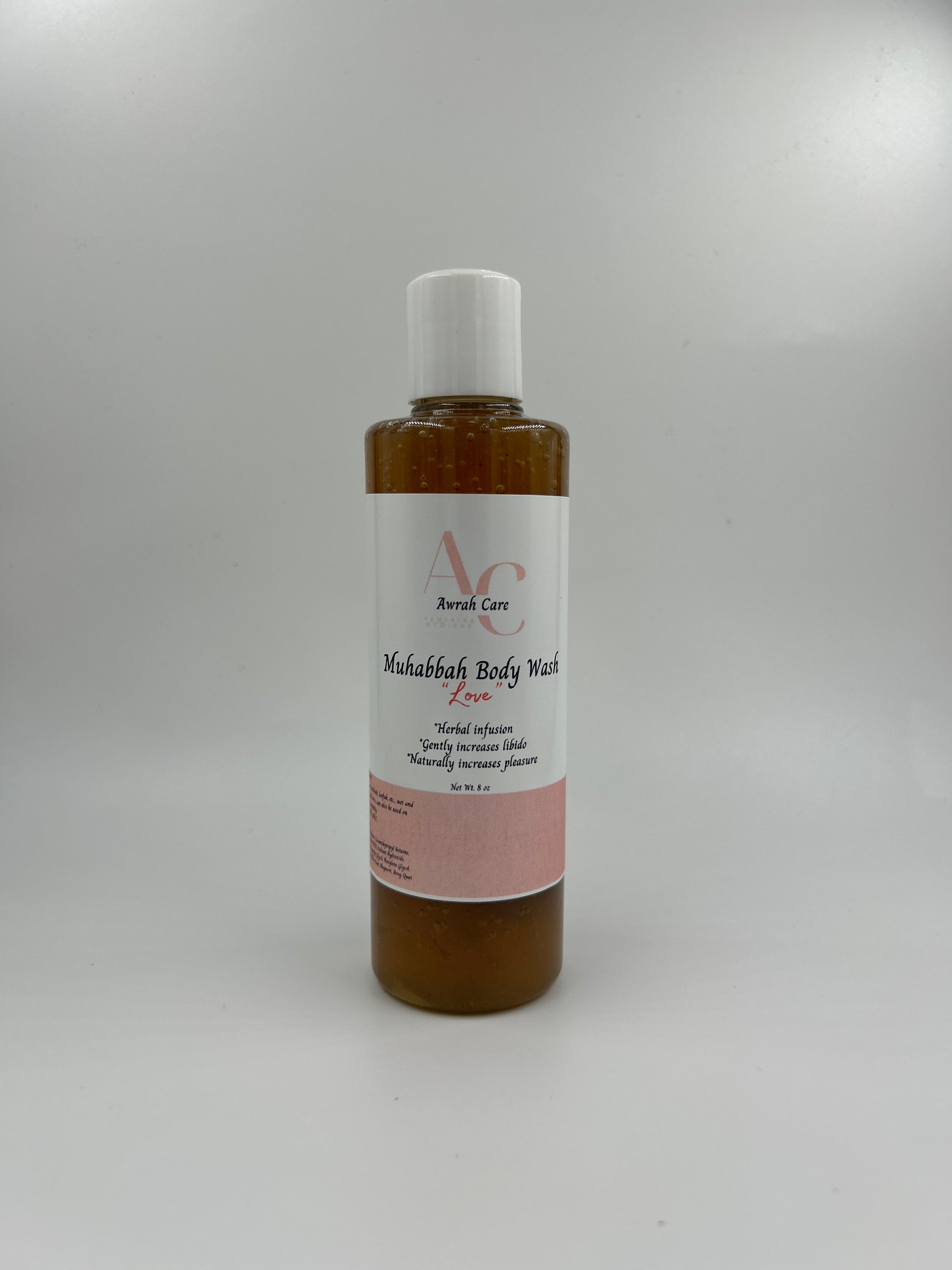 Small bottle with a label on a light gray background